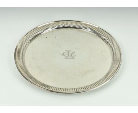 A George V silver tray, Barker Brothers, Chester 1916, of circular form with inner gadrooned rim, inscribed to centre with in
