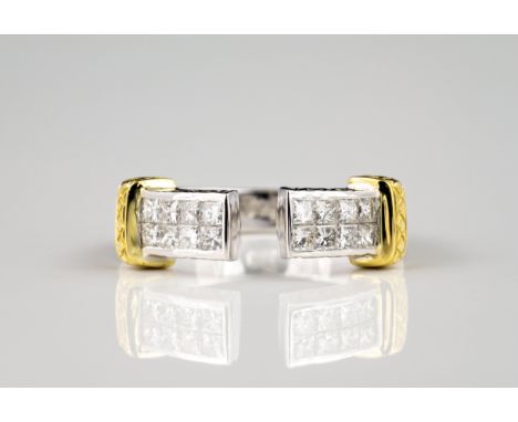 An 18ct two colour gold and diamond open ring, the divided ring set with two sets of eight princess cut diamonds to either si