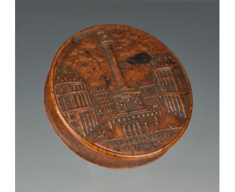 A Georgian French pressed burr wood snuff box, c.1810, of circular form, the lid depicting 'Coloane de La Place Vendome', Par
