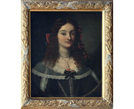 Follower of Juan Carreno de Miranda (Spanish, 1614-1685), Portrait of a young lady, quarter length, in a dark green dress wit