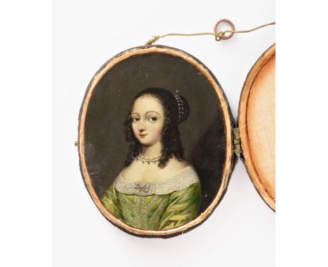 Continental School (18th century), Portrait miniature of a lady, half length, wearing a green lace trimmed dress with scallop