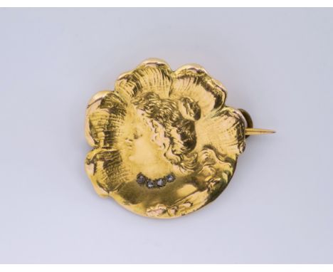 A French 18ct gold and diamond Art Nouveau style brooch, the flowerhead shaped brooch with a central portrait bust of a lady,