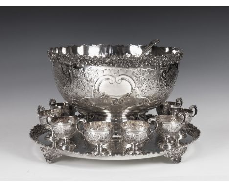 An impressive silver plated copper footed punch bowl on stand, by Barker & Ellis of England, with chased floral and foliate d