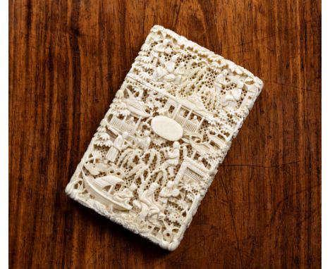 A good Chinese Canton carved ivory card case, 19th century, finely carved throughout with figures, a boat, a seated noblewoma