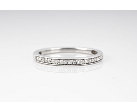 A 9ct white gold and diamond half eternity ring, pavé set with brilliant cut diamonds, size N.