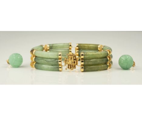 A Chinese 18ct gold and jade bracelet, the six links each with three curved jade cylinders with 18ct gold caps and hinged lin