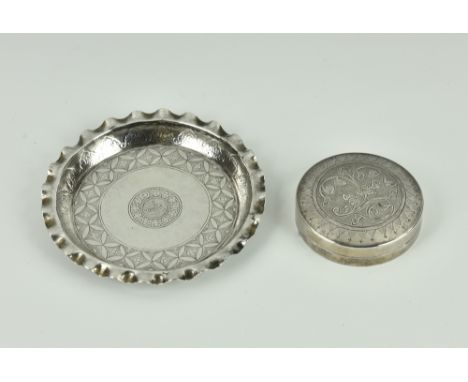 A Middle Eastern silver pin tray and snuff box, the pin tray of circular form with pie crust rim, decorated with repeating fl