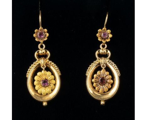A pair of vintage French 18ct gold and almandine garnet drop earrings, the oval stirrup drops with central garnet set flower,