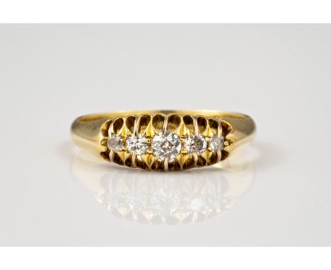 An Edwardian 18ct gold five stone diamond ring, hallmarked Chester 1909, claw set with five graduated old brilliant cut diamo