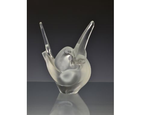 A Lalique Sylvie clear and frosted glass vase, fourth quarter 20th century, modelled as two interwined doves, etched factory 