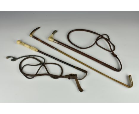 A vintage woven Swaine &amp; Adeney Ltd riding whip / crop, with horn handle and silver mounts; together with similar with or