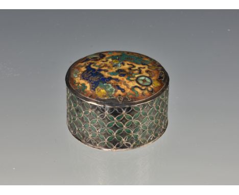 An antique Chinese silver and enamel circular patch box and cover, probably 19th century, worked in polychrome enamels and ra