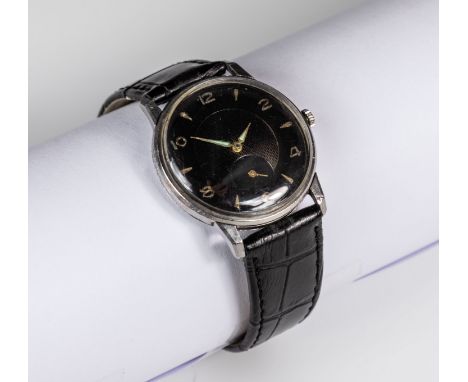 A gents 1950s Longines sub seconds manual wind wristwatch, the gloss black 28mm. dial with slightly convex chapter ring with 