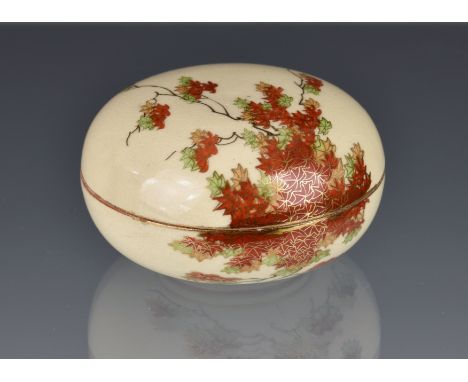 A Japanese earthenware Satsuma bun form pot and cover, early 20th century, painted with maple boughs in iron red, green and o
