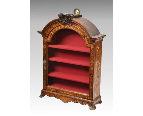 An early 19th century Dutch walnut and marquetry table top vitrine, the arched top with central foliate carved surmount, over