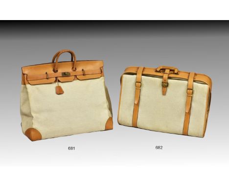 An Hermès toile and camel Birkin 60cm travel bag, the beige canvas bag with camel leather trim, twin hoop handles, stamped 'H