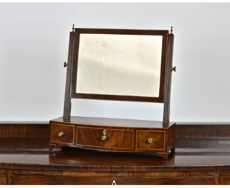 A George III inlaid mahogany box base bowfront toilet mirror, the rectangular, boxwood strung mirror on tapered reeded uprigh