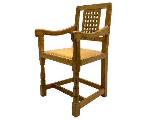 Mouseman - oak carver elbow chair, pierced and carved lattice back over leather upholstered seat with stud band, on octagonal