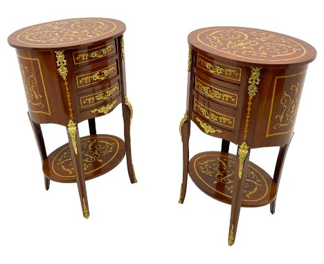 Pair of French design inlaid mahogany bedside lamp tables, oval form and fitted with three drawers, inlaid throughout with sc