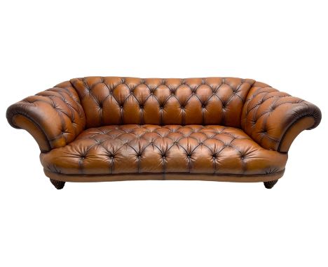 Tetrad - 'Oskar' grande three-seat sofa, Chesterfield shape with rolled arms, upholstered in buttoned tan leather, on turned 