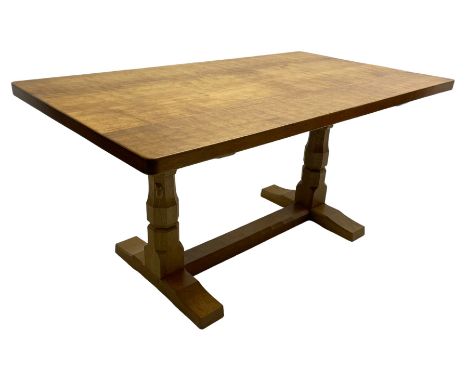 Mouseman - oak dining table, adzed rectangular top on twin octagonal pillar supports, sledge feet united by floor stretcher, 