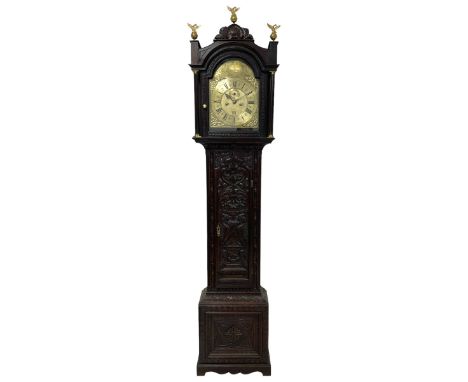 18th-century profusely carved oak longcase clock - with a pagoda pediment, upstands and carving,  break arch hood door flanke