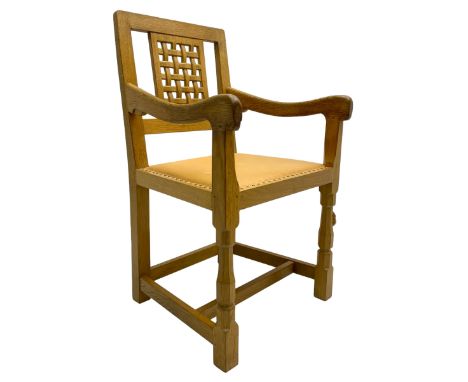 Mouseman - oak carver elbow chair, pierced and carved lattice back over leather upholstered seat with stud band, on octagonal