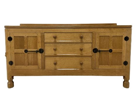 Mouseman - oak dresser, rectangular adzed top with raised back over three central drawers and two flanking cupboards, enclose