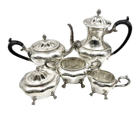 Five piece Edwardian silver tea service, comprising teapot and coffee pot, each with ebonised scroll handle, tea caddy with h