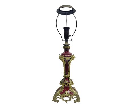 Late 19th century gilt metal mounted table lamp, the burgundy porcelain body of tapering form with applied gilt metal acanthu
