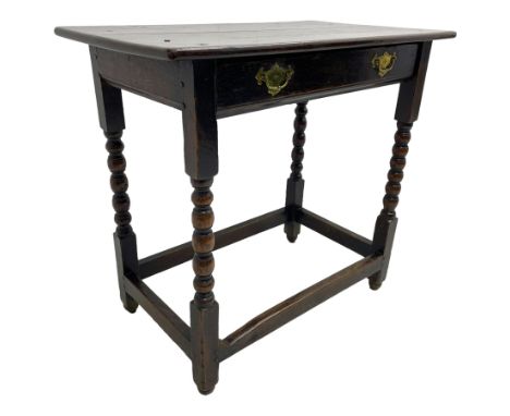 18th century oak low-boy, rectangular two-plank top over a single drawer with pressed brass handle plates, raised on bobbin-t