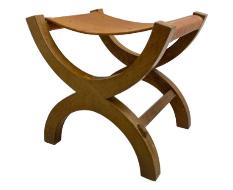 Mouseman - oak curved X-framed stool with slug tan leather seat, carved with mouse signature, by the workshop of Robert Thomp