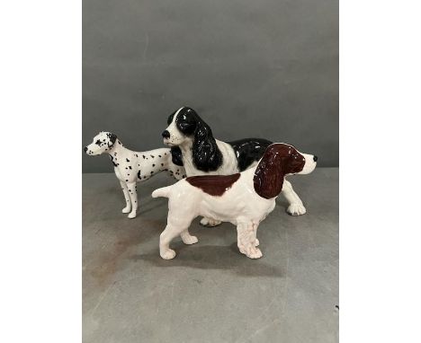 Three Beswick ceramic dogs to include spaniels (H18cm tallest) 