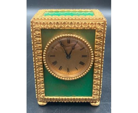 A French Hour Lavigne travel alarm clock with green panels