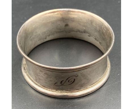 A silver napkin ring