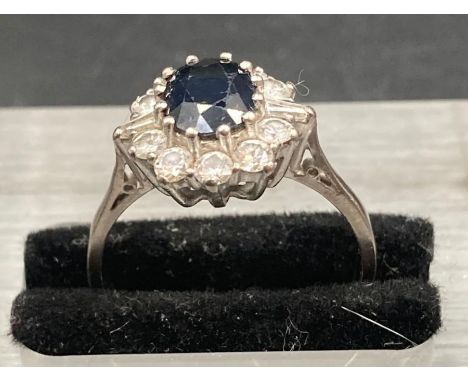 A vintage sapphire and diamond cluster ring on 18ct gold and platinum. Total sapphire weight is approx 1.4cts, total weight 0