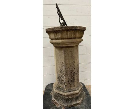 A weathered sundial 
