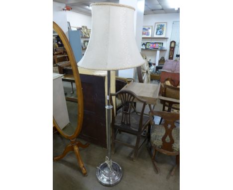 A chrome floor standing lamp 