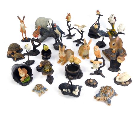 A group of Bowbrook Studios by Worcester animals ornaments, comprising the woodpecker, finch on a garden roller, cat in baske