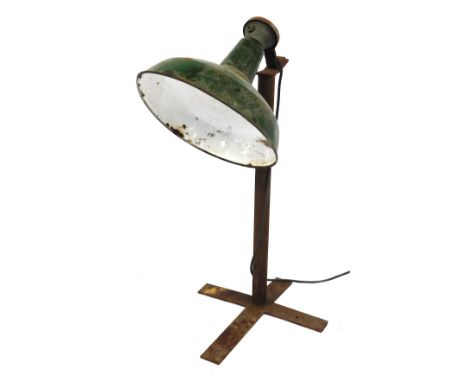 An mid 20thC industrial floor standing lamp, with a green and white enamel shade, 94cm high.(AF)Buyer Note: WARNING! This lot