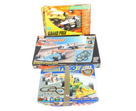 Three racing games, comprising Tyco Racing Grand Prix, Formula Tyco, and a micro Scalextric, boxed. (3)