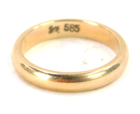 A wedding band, of plain design, yellow metal stamped 585, ring size I½, 3.6g. 