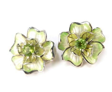 A pair of Nicole Bar silver and enamel peridot floral cluster earrings, each of two layer design with central peridot on clip