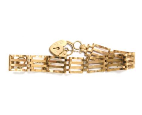 A 9ct gold gate bracelet, of four bar design, with safety chain and heart shaped padlock, 16cm long, 9.1g. 