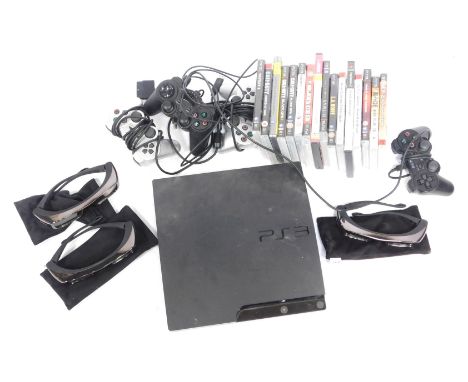 A PlayStation 2 games console, various controllers, and games. 