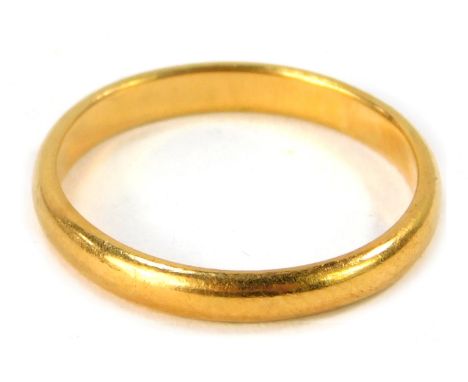 A 22ct gold wedding band, of plain design, maker H &amp; M Birmingham 1962, size K 1/2, 2.7g all in.