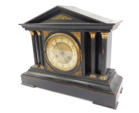 A late 19thC ebonised mantel clock, circular brass dial with chapter ring bearing Arabic numerals, Junghans eight day movemen