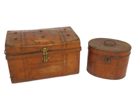 An early 20thC tin hat box, 32cm high, together with a tin trunk, with cast iron carrying handles, and brass lock plate, 58cm