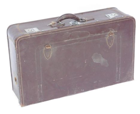 A vintage dark brown leather trunk, with a turquoise silk and lined interior, 81cm wide, 48cm deep.