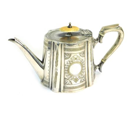 A Victorian silver plated teapot, of fluted tapering form, with engraved decoration, circular vacant reserves, 22cm wide. 